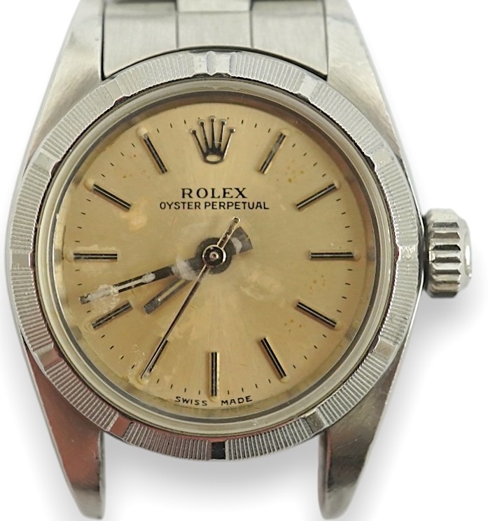 A lady's 1990's stainless steel Rolex Oyster Perpetual wrist watch, on a stainless steel Rolex bracelet